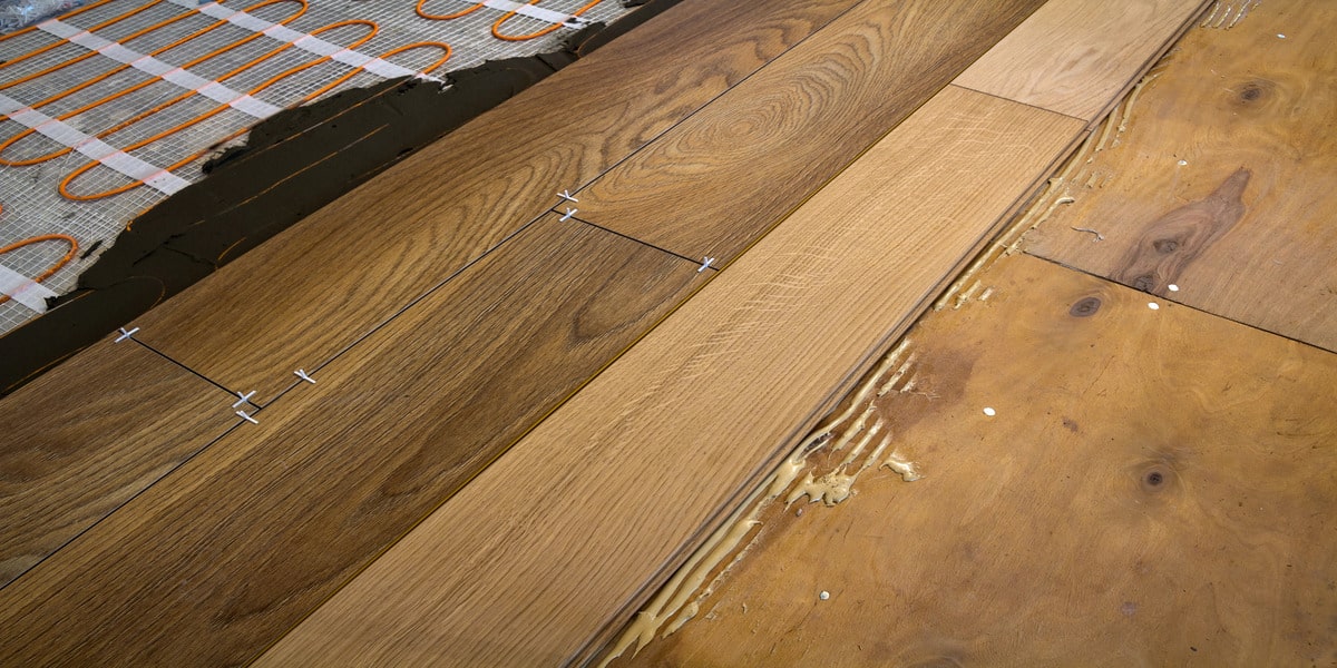 In Home Flooring explains Add Radiant Heat Under Hardwood. Wood flooring installation with underfloor heating enhances warmth and comfort.