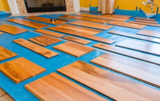 Best Priced Flooring Co in Colorado: Hardwood flooring that balances cost & quality by In Home Flooring, shown neatly laid out for installation